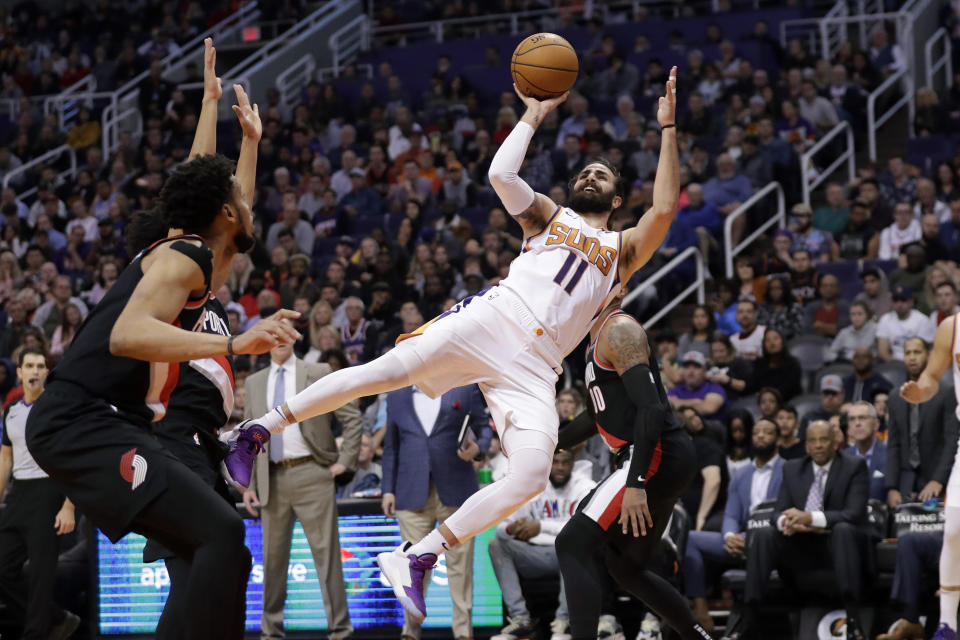 Phoenix Suns guard Ricky Rubio (11) shoots against the Portland Trail Blazers during the second half of an NBA basketball game, Monday, Dec. 16, 2019, in Phoenix. The Trail Blazers won 111-110. (AP Photo/Matt York)