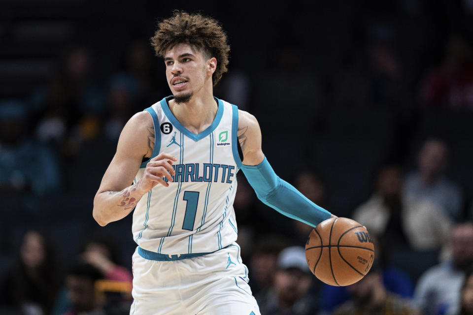 Charlotte Hornets guard LaMelo Ball brings the ball up during the first half of the team's NBA basketball game against the Indiana Pacers in Charlotte, N.C., Wednesday, Nov. 16, 2022. (AP Photo/Jacob Kupferman)