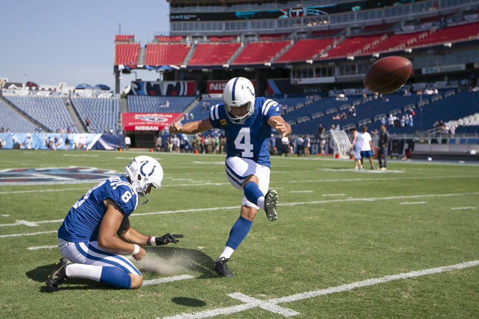 Indianapolis Colts kicker Adam Vinatieri (4) warms up with holder Rigoberto Sanchez (8) before an NFL football game against the Tennessee Titans Sunday, Sept. 15, 2019, in Nashville, Tenn. (AP Photo/James Kenney)
