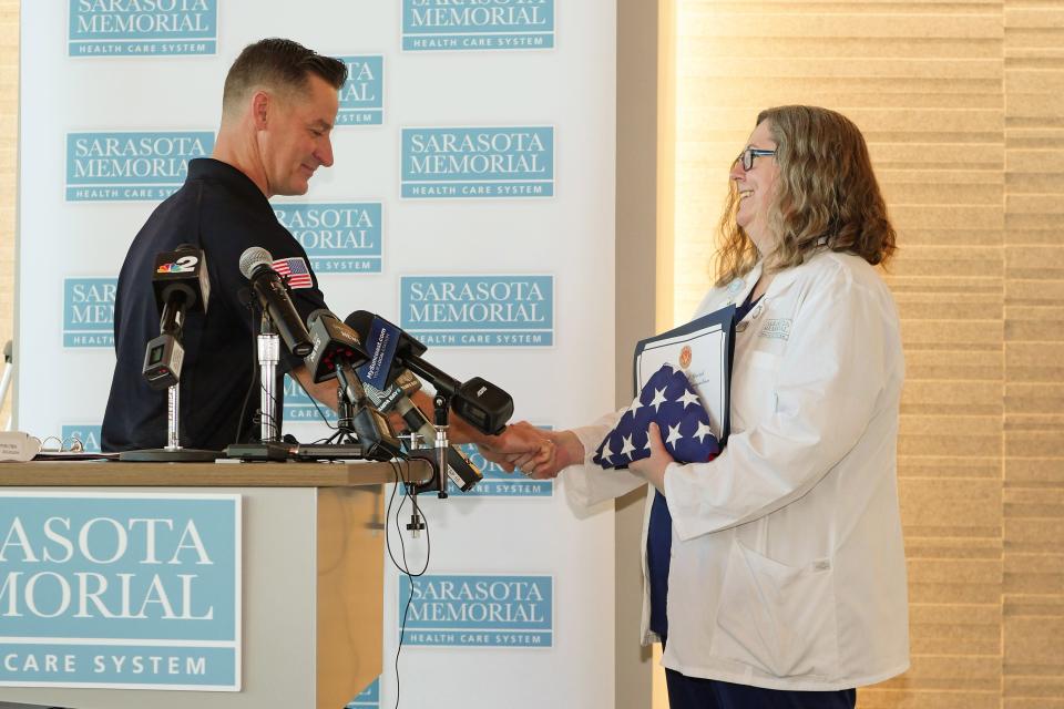U.S. Rep. Greg Steube, R-Sarasota, left, presented a U.S flag that flew atop the Capitol, a certificate of Congressional excellence and one of his personal Congressional challenge coins to Jennifer Sweeney, Trauma Program Manager at Sarasota Memorial Hospital, as part of a thank-you to the staff at Sarasota Memorial Hospital’s Level II Trauma center for the care he received after falling off a 25-foot-tall ladder while trimming a tree branch last month.
