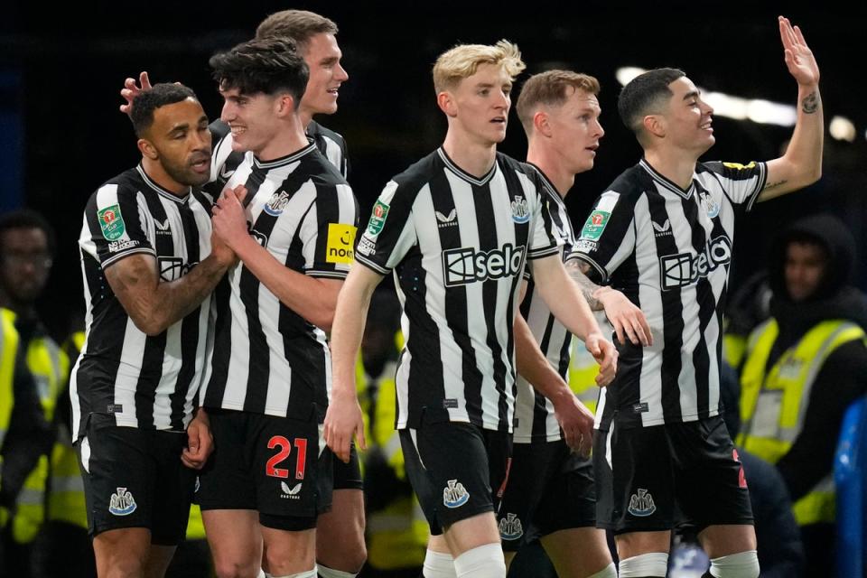 Newcastle’s Callum Wilson celebrates with teammates after scoring (AP)