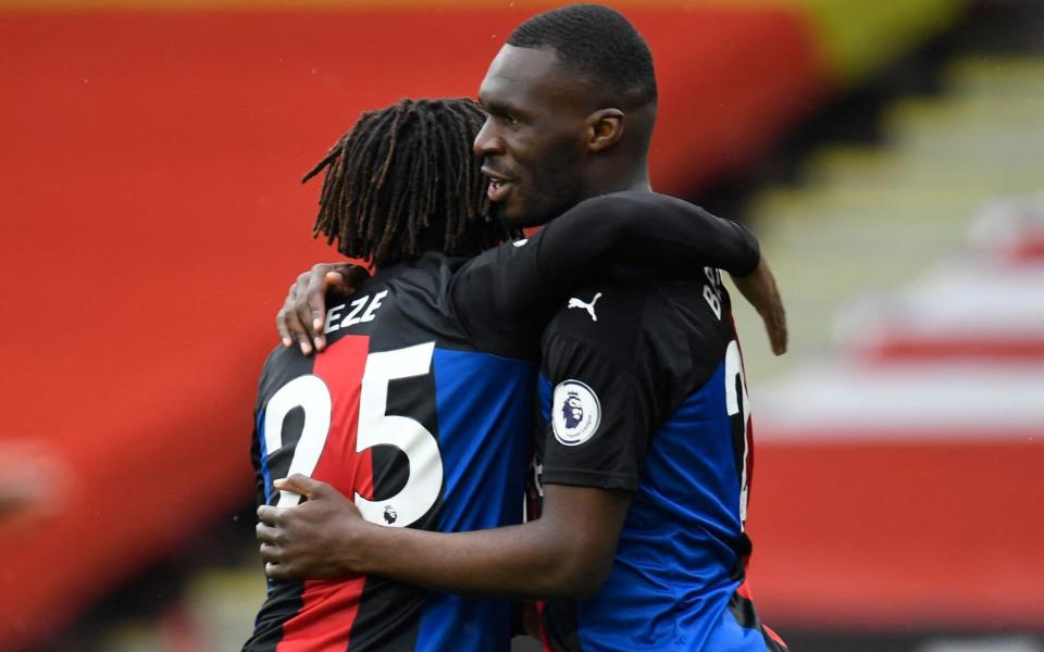 Christian Benteke celebrates with Eze after making it 1-0 to Crystal Palace early on - AFP