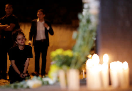 A student reacts while paying tribute to victims of the shooting in the Raul Brasil school in Suzano, Sao Paulo state, Brazil March 13, 2019. REUTERS/Ueslei Marcelino