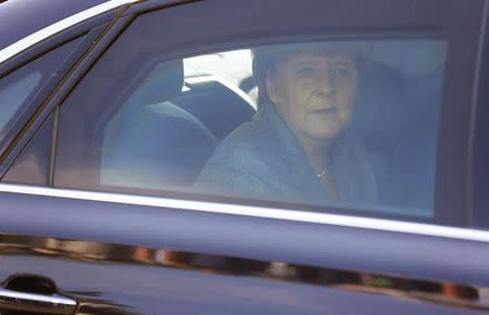 German Chancellor Angela Merkel leaves after her visit to an asylum seekers accomodation facility in the eastern German town of Heidenau near Dresden, August 26, 2015 where last week more than 30 police were injured in clashes, when a mob of several hundred people pelted officers with bottles and fireworks. REUTERS/Axel Schmidt