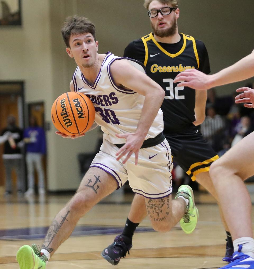 Mount Union's Zander Sabin (30) drives to the hoop during a game this season.