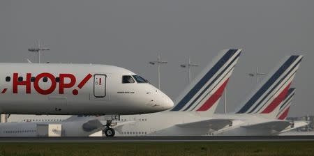 Air France-KLM French regional airline unit Hop taxies to the runway at the Charles-de-Gaulle airport, near Paris April 8, 2015. REUTERS/Gonzalo Fuentes