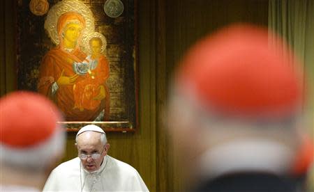 Pope Francis looks on as he arrives to lead a special consistory for the family in the Paul VI's hall at the Vatican February 20, 2014. REUTERS/Max Rossi