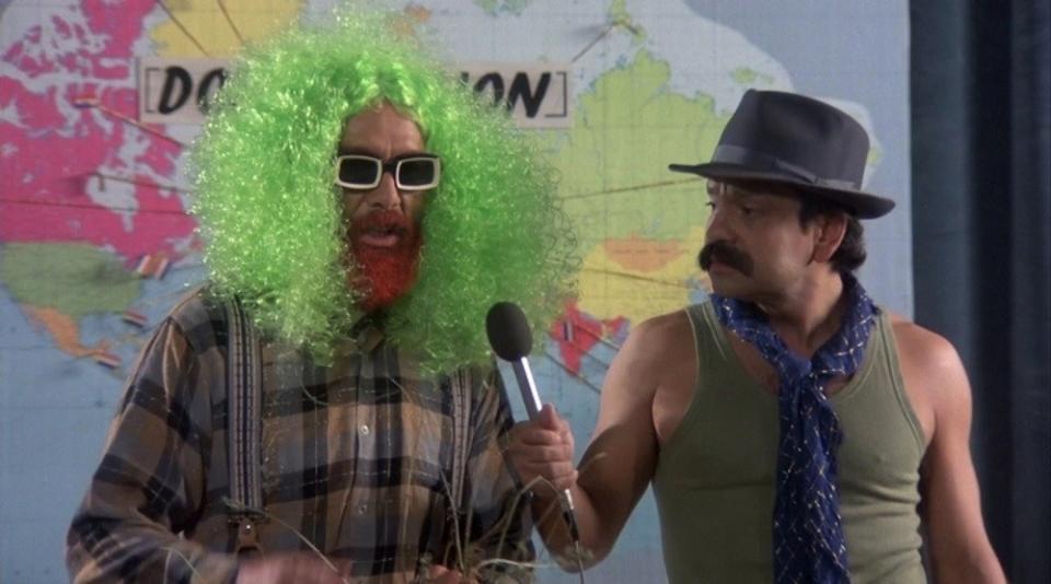 Cheech and Chong standing in front of a map