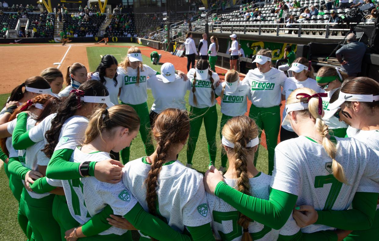 Oregon players gather on the field before their softball game against Oregon State at Jane Sanders Stadium Sunday, April 21, 2024