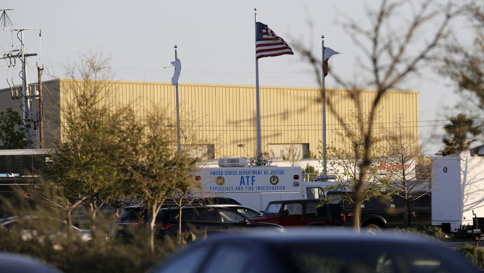 <p>An ATF vehicle sits in front of a FedEx distribution center where a package exploded, Tuesday, March 20, 2018, in Schertz, Texas. Authorities believe the package bomb is linked to the recent string of Austin bombings. (Photo: Eric Gay/AP) </p>