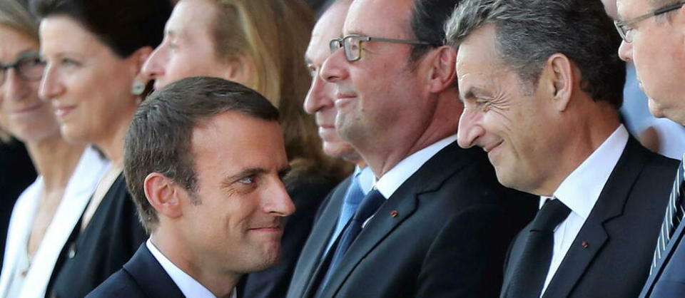 Le président Emmanuel Macron, les ex-présidents François Hollande et Nicolas Sarkozy se retrouvent pendant la cérémonie de commémoration de l'attentat de Nice.  - Credit:VALERY HACHE / AFP