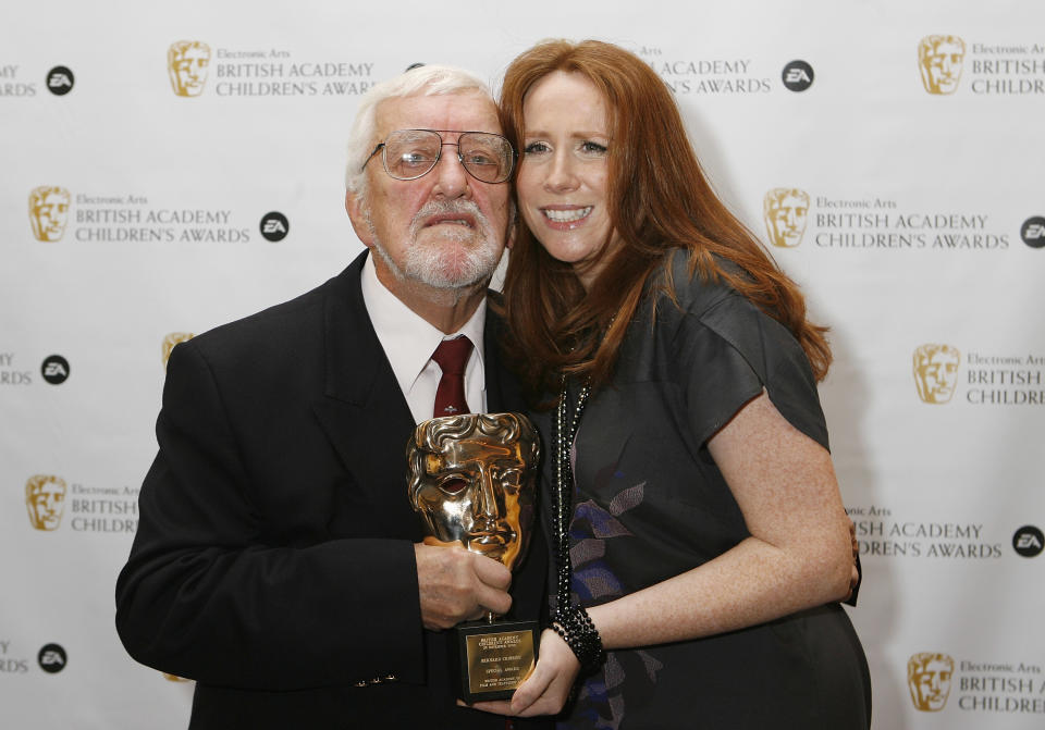 LONDON, UNITED KINGDOM - NOVEMBER 29: (UK TABLOIDS,NEWSPAPERS OUT) Bernard Cribbins with The Special Award with Catherine Tate in the press room at the 'EA British Academy Children's Awards 2009' at The London Hilton on November 29, 2009 in London, England. (Photo by Jo Hale/Getty Images)