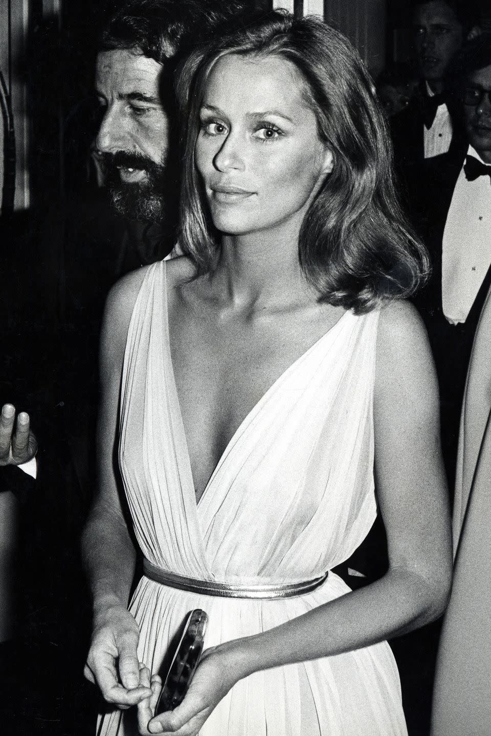 <p>The ultra-plunging neckline was obviously a major Oscars trend in the '70s. Lauren Hutton made sure to channel her inner Greek goddess at the ceremony with this white, flowy gown. </p>