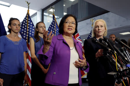 U.S. Senator Mazie Hirono (D-HI) speaks at a news conference with Senator Kirsten Gillibrand (D-NY) as they stand with Holton-Arms alumnae Kate Gold (L), Sarah Burgess and others to release a letter from more than a thousand graduates of the school that Dr. Christine Blasey Ford attended voicing their belief in and support of Ford's accusations against President Donald Trump's U.S. Supreme Court nominee Brett Kavanaugh on Capitol Hill in Washington, U.S., September 20, 2018. REUTERS/Yuri Gripas