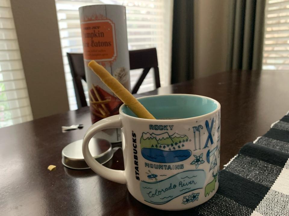 pumpkin spice batons in a mug of coffee