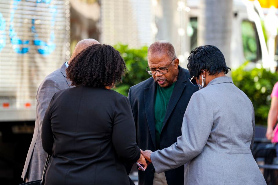 Members of the Lee County NAACP paused for a prayer before crossing the street to the First Street Restaurant, in downtown Fort Myers, where they went Friday to seek an apology for alleged racist comments and treatment of Black people. President of the Lee County NAACP, James Muwakkil, and other NAACP members went to the restaurant to meet with the owner Bill  Babamov to negotiate a resolution. Babamov talked for about 20 minutes with Muwakkil but did not offer an apology, Muwakkil said. More information about the incident was given to Babamov from the NAACP. Babamov wanted to take this information into consideration and the two will meet again in a couple of days.