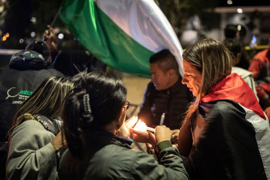 People protest to show support for the Palestinian people in the latest Israel-Hamas war, in front of the Israeli embassy in Bogota, Colombia, Thursday, Oct. 19, 2023. (AP Photo/Ivan Valencia)