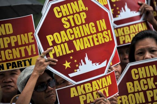 Filipinos protest outside the Chinese Consular Office in Manila in April 2012, against the Chinese navy presence on Scarborough Shoal, a reef close to the Philippine coastline