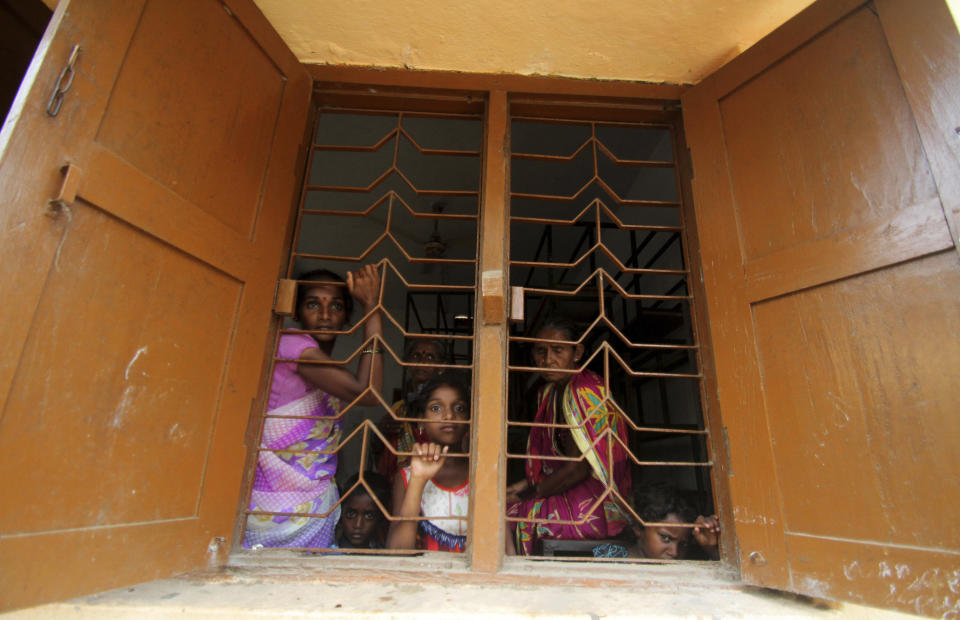 Villagers of Chandrabhaga fishing village take shelter at a government run school building after they were evacuated by the authorities in Puri district of eastern Odisha state, India, Thursday, May 2, 2019. Hundreds of thousands of people were evacuated along India's eastern coast on Thursday as authorities braced for a cyclone moving through the Bay of Bengal that was forecast to bring extremely severe wind and rain. (AP Photo)
