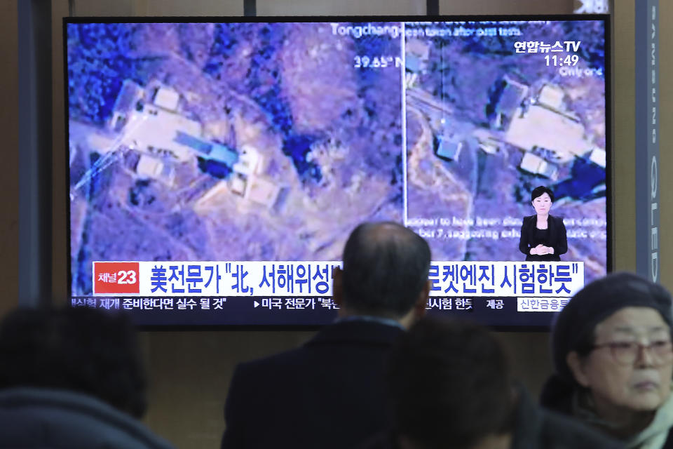 A man watches a TV screen showing an image of a North Korean long-range rocket launch site during a news program at the Seoul Railway Station in Seoul, South Korea, Monday, Dec. 9, 2019. North Korea said Sunday it carried out a "very important test" at its long-range rocket launch site that it reportedly rebuilt after having partially dismantled it after entering denuclearization talks with the United States last year. The sign reads: "North Korea seems to have tested the rocket engine." (AP Photo/Ahn Young-joon)