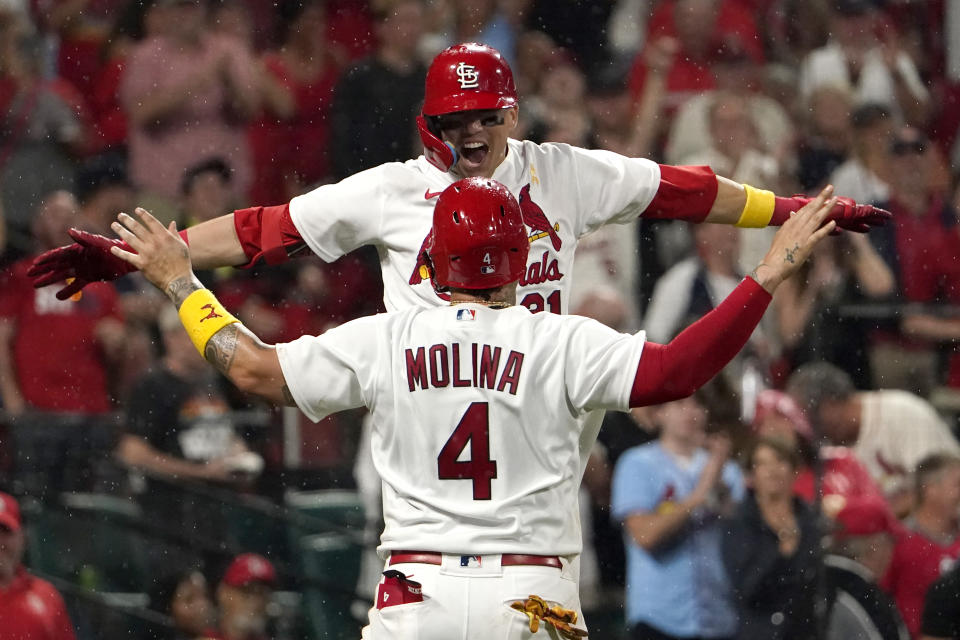 St. Louis Cardinals' Lars Nootbaar, top, is congratulated by teammate Yadier Molina (4) after hitting a two-run home run during the seventh inning of a baseball game against the Chicago Cubs Friday, Sept. 2, 2022, in St. Louis. (AP Photo/Jeff Roberson)