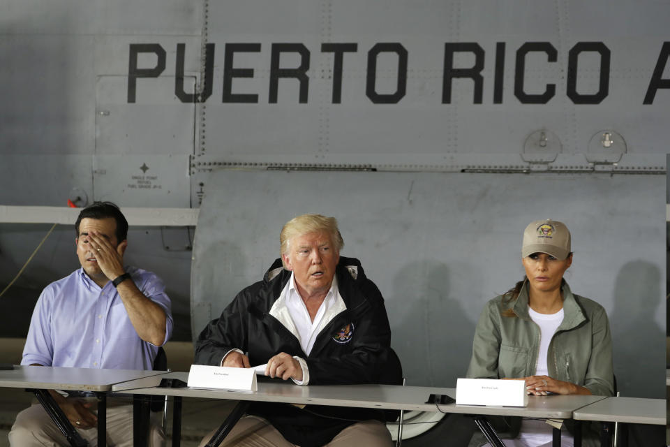 President Trump and first lady Melania Trump arrive at Luis Muniz Air National Guard Base to survey hurricane damage and recovery efforts in San Juan, Puerto Rico, Oct. 3, 2017. (AP Photo/Evan Vucci)     