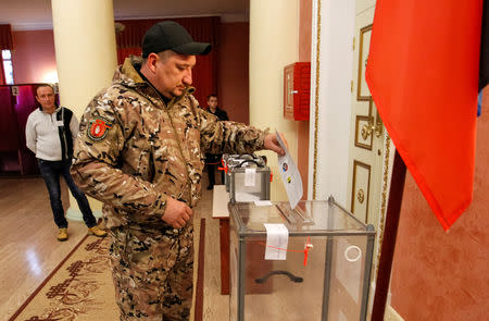 A man casts his ballot during leadership elections in rebel-controlled Donetsk, Ukraine November 11, 2018. REUTERS/Alexander Ermochenko