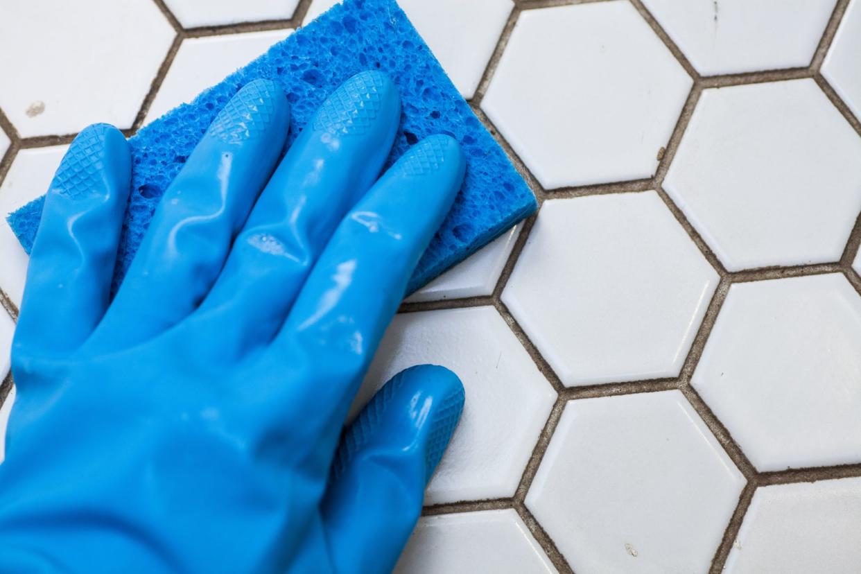 Use baking soda, hydrogen peroxide and dish soap to clean dirty tile grout.