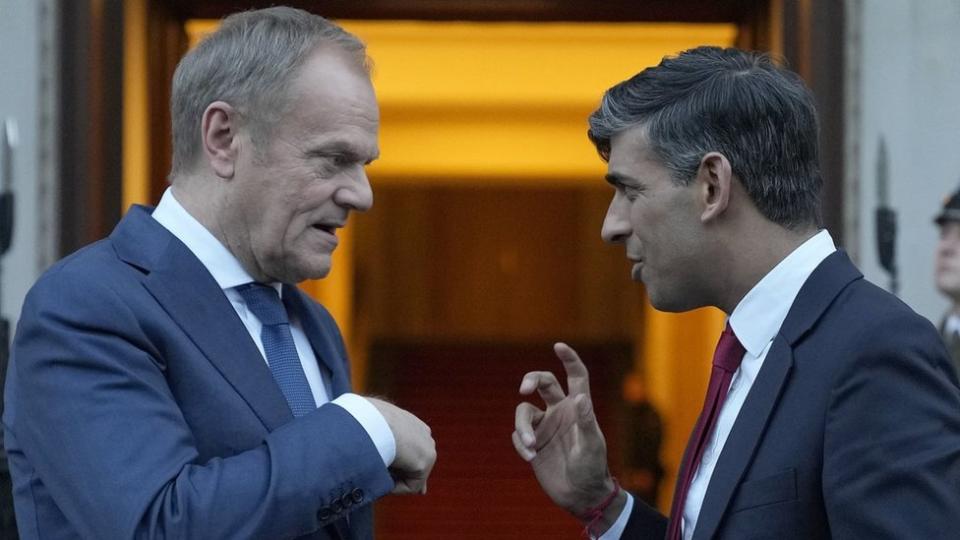 Prime Minister Rishi Sunak (right) talks to Polish Prime Minister Donald Tusk before leaving Warsaw, Poland.