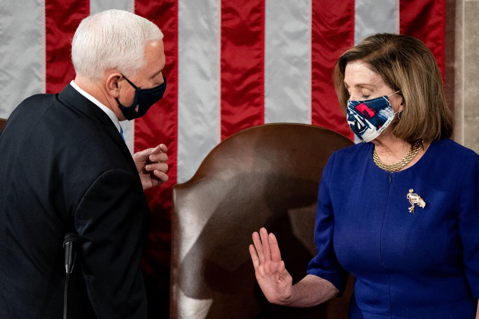 House Speaker Nancy Pelosi and Vice President Mike Pence preside over a Joint session of Congress to certify the 2020 Electoral College results on Capitol Hill in Washington, DC, January 6, 2021. - Congress is meeting to certify Joe Biden as the winner of the 2020 presidential election, with scores of Republican lawmakers preparing to challenge the tally in a number of states during what is normally a largely ceremonial event. (Photo by Erin Schaff / POOL / AFP) (Photo by ERIN SCHAFF/POOL/AFP via Getty Images)