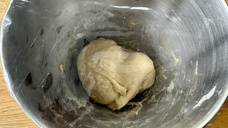 dough in plastic covered bowl