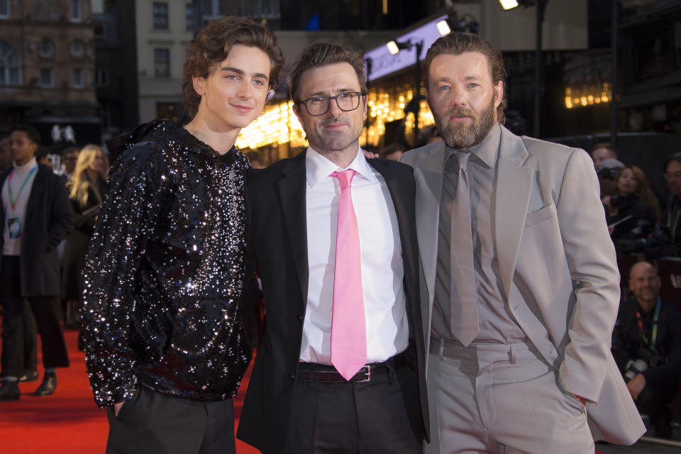 FILE - This Oct. 3, 2019 file photo shows Timothee Chalamet, left, and Joel Edgerton, right, with director David Michôd at the premiere of the "The King" during the London Film Festival, in central London. Chalamet portrays King Henry V in the period drama in theaters this week. (Photo by Vianney Le Caer/Invision/AP, File)