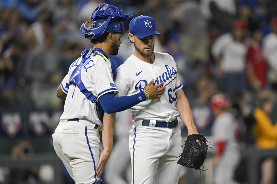 Kansas City Royals relief pitcher Josh Staumont (63) is congratulated by catcher MJ Melendez (1) after they defeated the Los Angeles Angels in a baseball game, Monday, July 25, 2022, in Kansas City, Mo. (AP Photo/Reed Hoffmann)