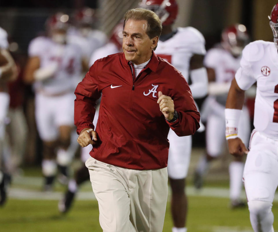 Nick Saban has gotten his fair share of political write-in votes for different offices, but we’re sure he’d welcome President Trump on the field at the national championship. (AP)