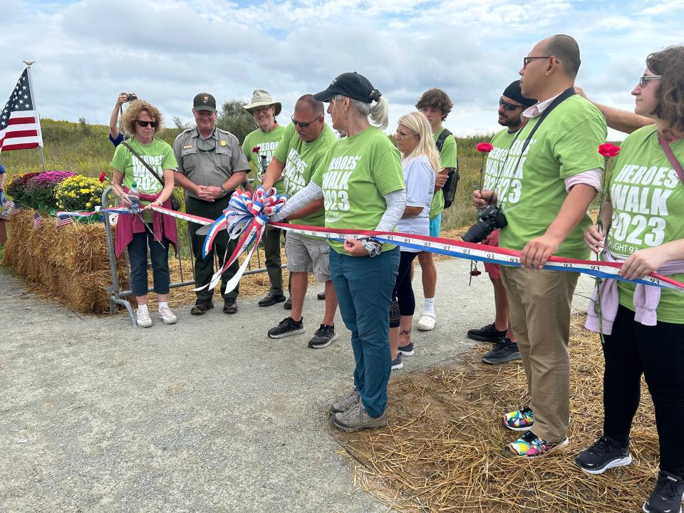 Ribbon cut for the first visitors to enter at a sacred place at Flight 93 National Memorial.