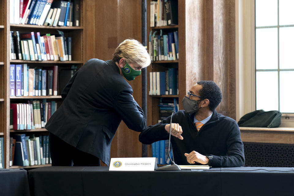 Energy Secretary Jennifer Granholm elbow bumps student Christopher Flowers after a roundtable discussion at Howard University in Washington, Monday, May 3, 2021. (Stefani Reynolds/Pool via AP)