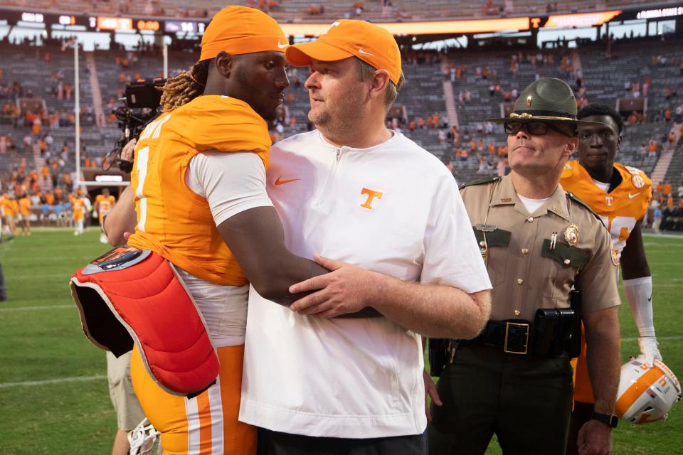 Tennessee quarterback Joe Milton III (7) and head coach Josh Heupel celebrate after the win over UTSA in an NCAA college football game on Saturday, September 23, 2023 in Knoxville, Tenn.