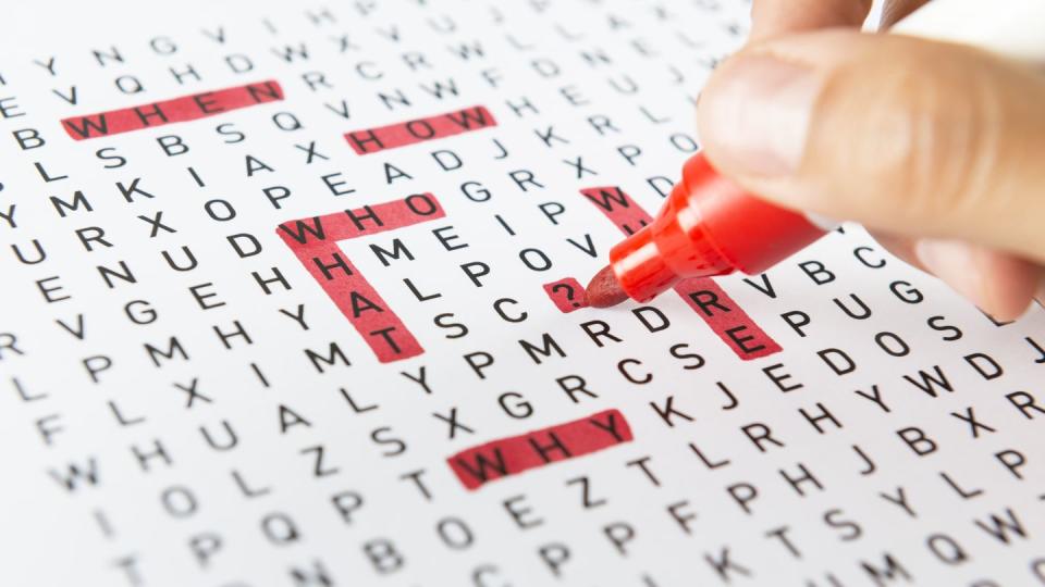 back to school activities, hand doing a word search with a red marker