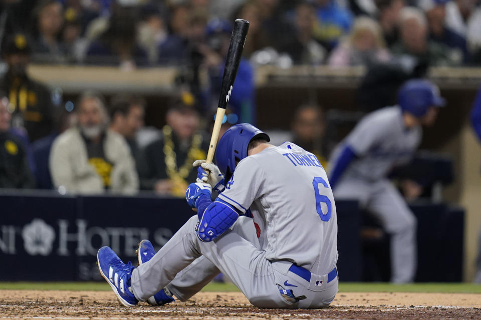 Los Angeles Dodgers' Trea Turner reacts while batting during the fifth inning of the team's baseball game against the San Diego Padres, Friday, April 22, 2022, in San Diego. (AP Photo/Gregory Bull)