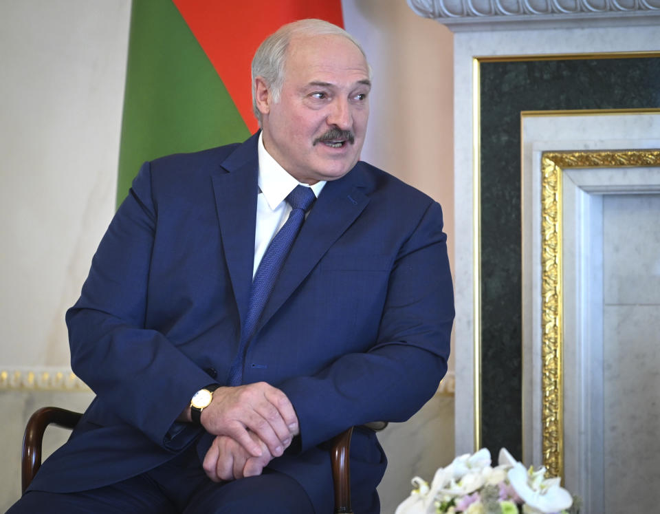Belarusian President Alexander Lukashenko talks with Russian President Vladimir Putin during their meeting in St. Petersburg, Russia, Tuesday, July 13, 2021. (Alexei Nikolsky, Sputnik, Kremlin Pool Photo via AP)