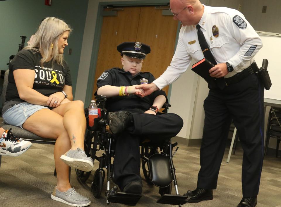 Gastonia Police Chief Trent Conard shakes the hand of Jackson Hall during his swearing in ceremony Monday morning at the Gastonia Police Department.