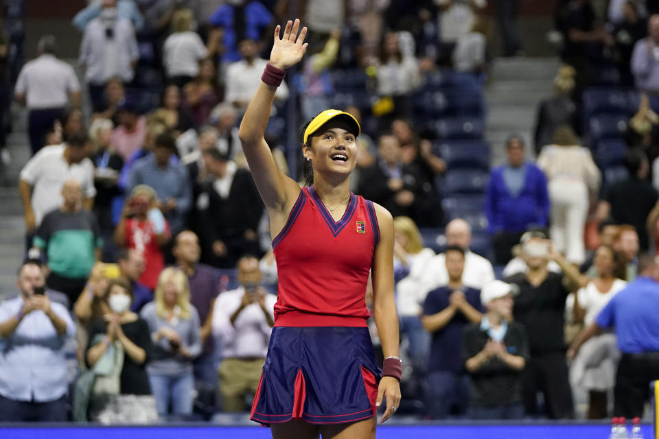 Emma Raducanu, of Great Britain, waves to the crowd after defeating Maria Sakkari, of Greece, during the semifinals of the US Open tennis championships, Thursday, Sept. 9, 2021, in New York. (AP Photo/Frank Franklin II)