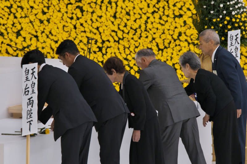 Bereaved families of the war dead offer flower during the memorial service for the war dead of World War II. Photo by Keizo Mori/UPI