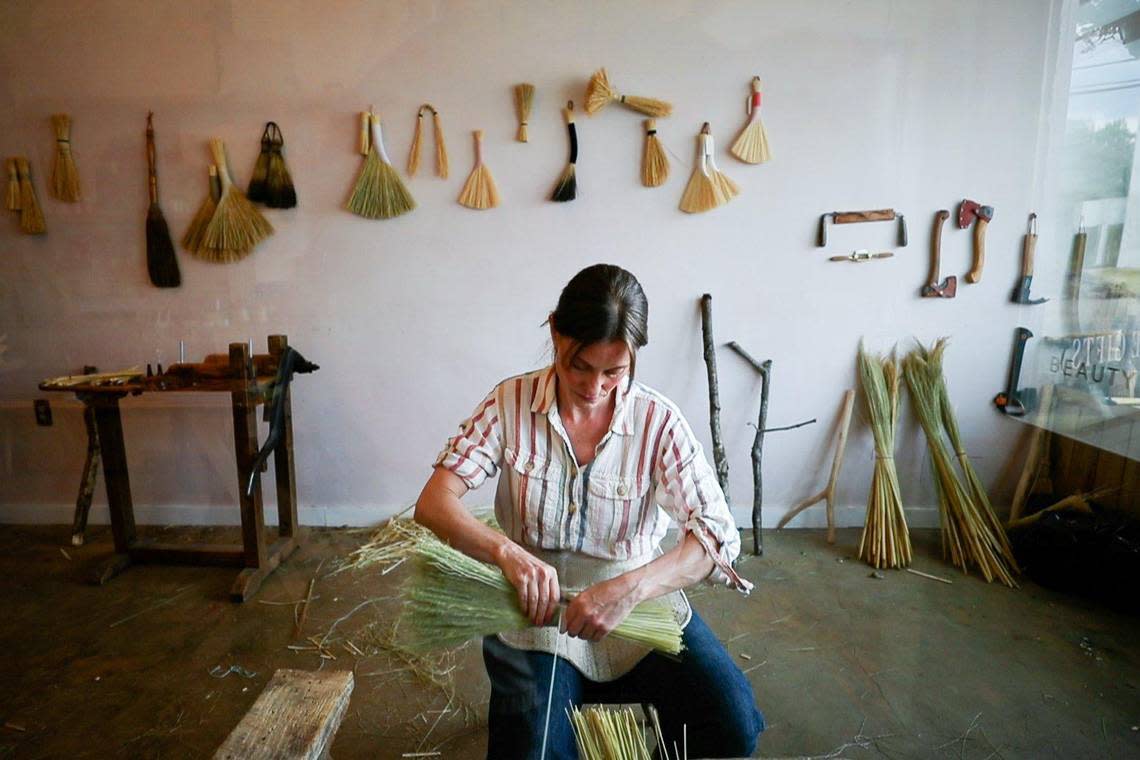 Cynthia Main makes a hand broom in her workshop on Saturday, June 25, 2022, at Sunhouse Craft in Berea. The shop is one of several in the city that have found success opening during the pandemic.