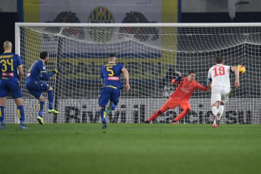 Verona forward Giampaolo Pazzini scores the winning penalty