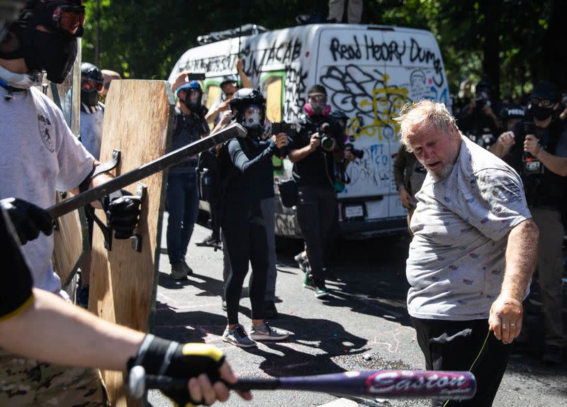 Protesters and counter-protesters face off against one another in Portland