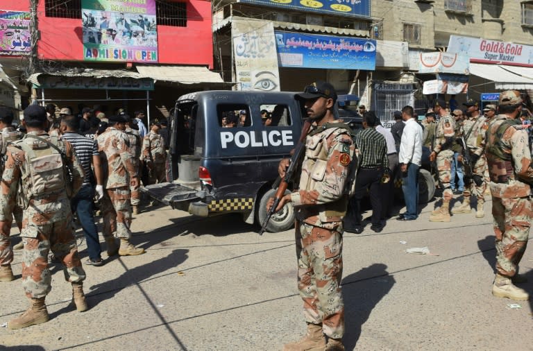 Pakistani security personnel on the streets of Karachi after gunmen shot dead seven policemen guarding a polio vaccination team on April 20, 2016