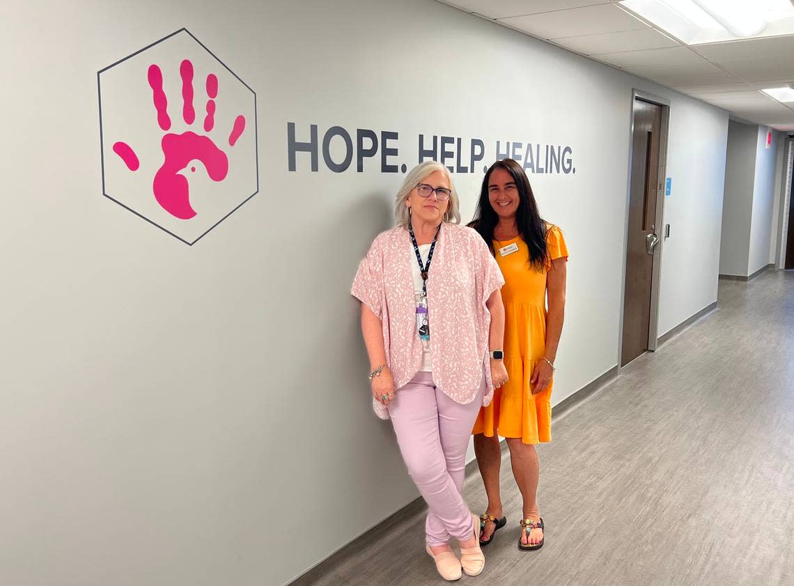 Tammy Margeson, the Crisis Program Director, and Michele Chassner, the NC Regional Customer Relations Liaison, stand in the hallway of The Hope Center that was opened on June 5, 2023.