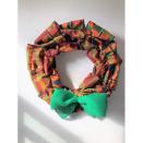<p><strong>Chez Kevito</strong></p><p>walmart.com</p><p><strong>$55.00</strong></p><p>Dress up any door with this Kente cloth wreath, which measures 15 inches in diameter and is versatile enough to keep up on your door all year round. </p>