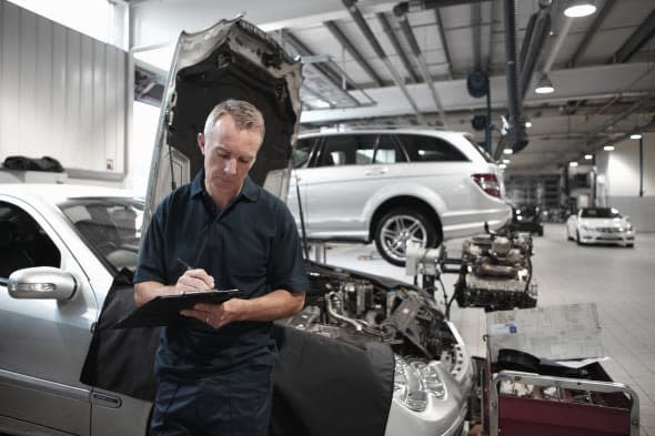 Mechanic working in auto repair shop